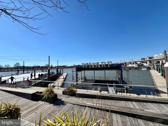 a front view of a building with a garden