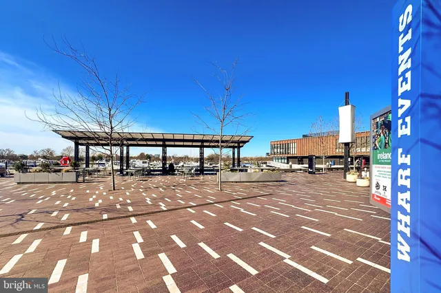 a view of a patio with table and chairs with wooden floor