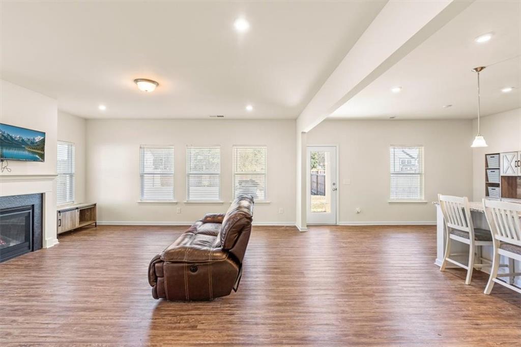 401 Larry Lane Adairsville, GA 30103 - Photo 16 of 41 a living room with furniture and a wooden floor