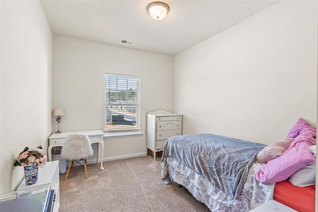 401 Larry Lane Adairsville, GA 30103 - Photo 18 of 41 a bedroom with a bed and a window