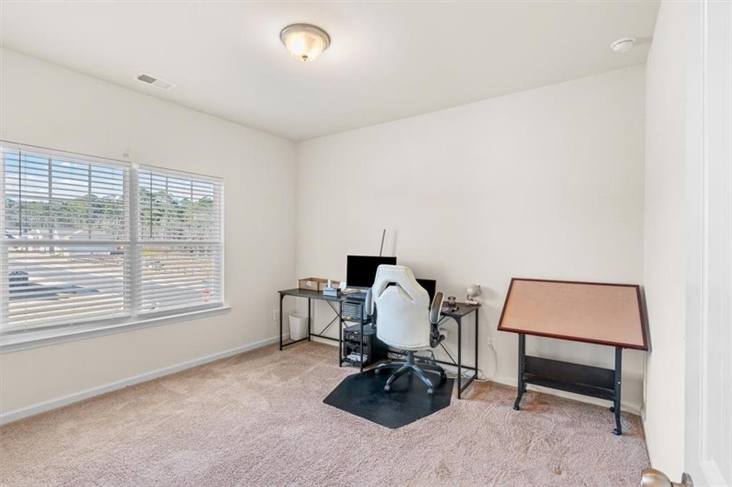 401 Larry Lane Adairsville, GA 30103 - Photo 19 of 41 a workspace with furniture and a window
