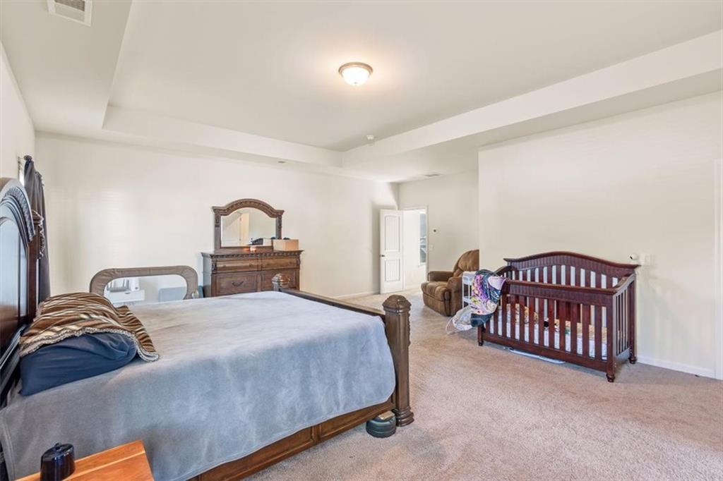401 Larry Lane Adairsville, GA 30103 - Photo 23 of 41 a bedroom with a bed and a dresser