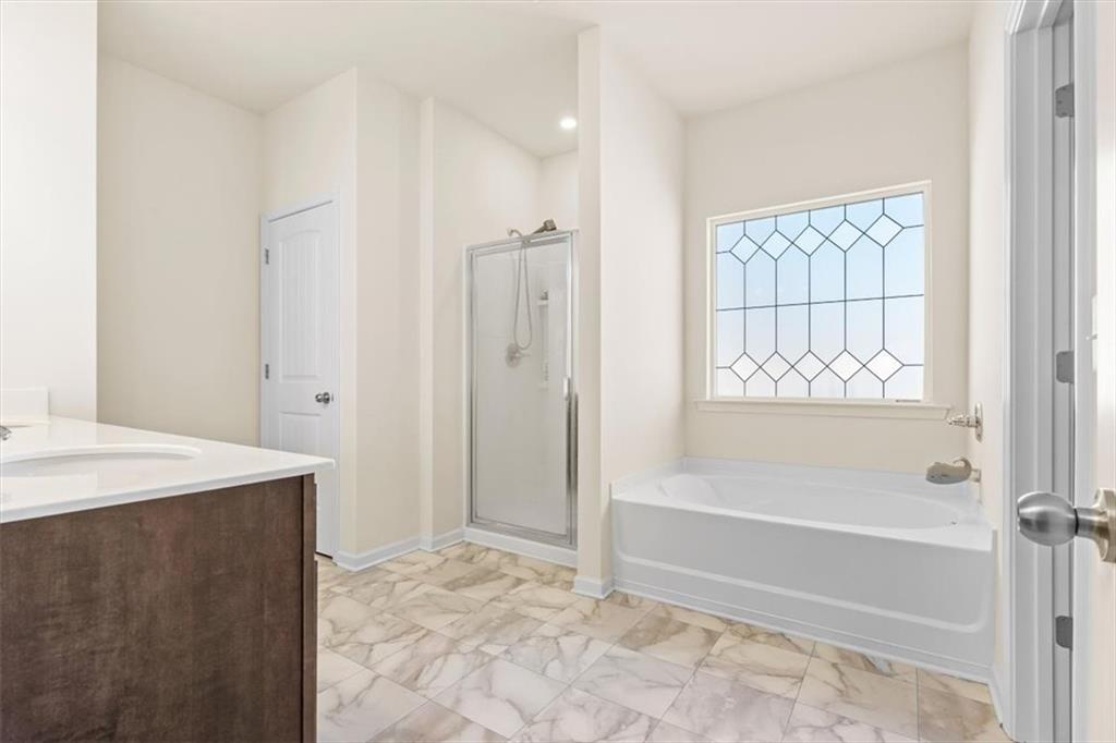 401 Larry Lane Adairsville, GA 30103 - Photo 25 of 41 a spacious bathroom with a tub shower and a sink