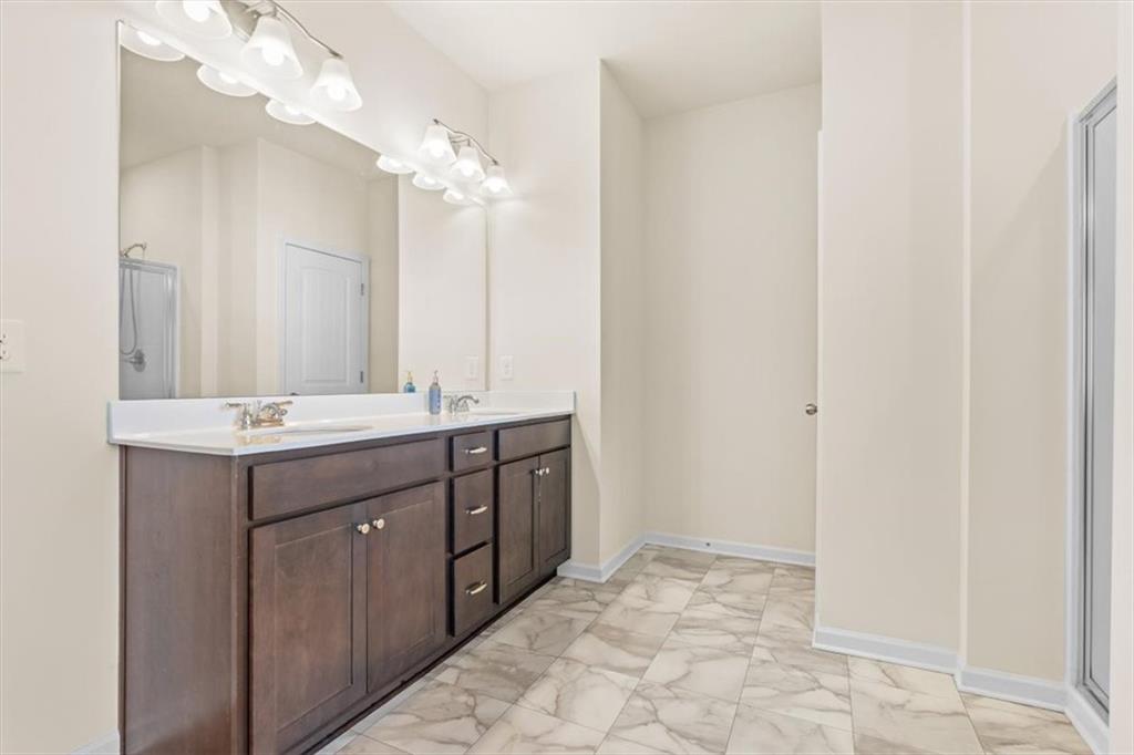 401 Larry Lane Adairsville, GA 30103 - Photo 26 of 41 a bathroom with a sink and a mirror