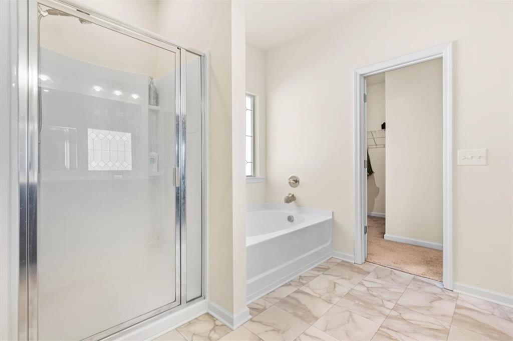 401 Larry Lane Adairsville, GA 30103 - Photo 27 of 41 a bathroom with a bathtub and a shower