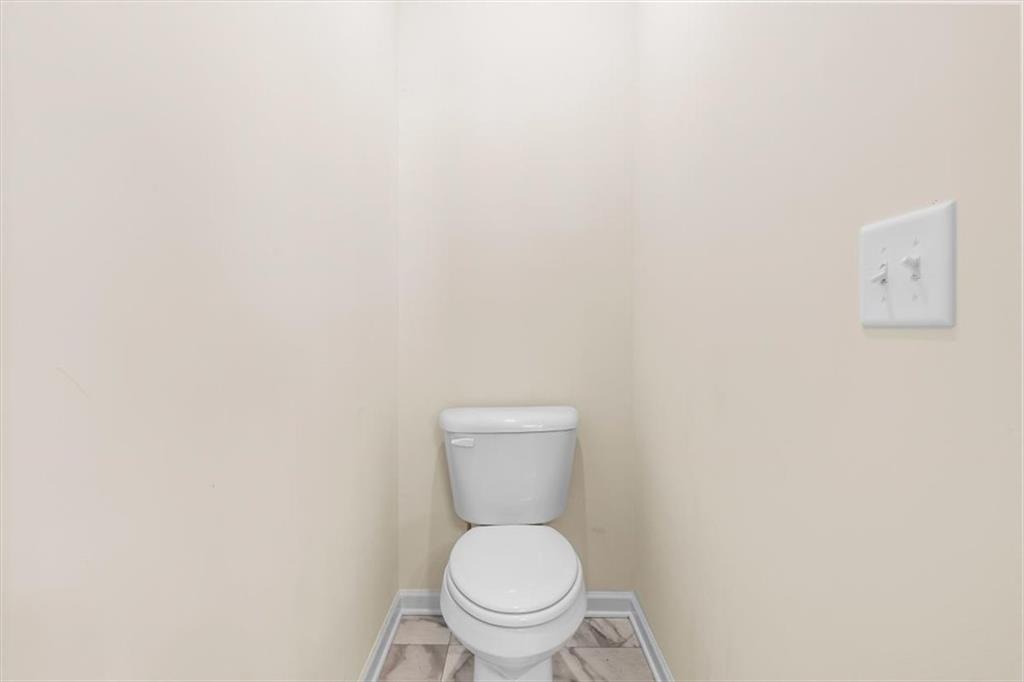 401 Larry Lane Adairsville, GA 30103 - Photo 28 of 41 a white toilet sitting next to a white wall