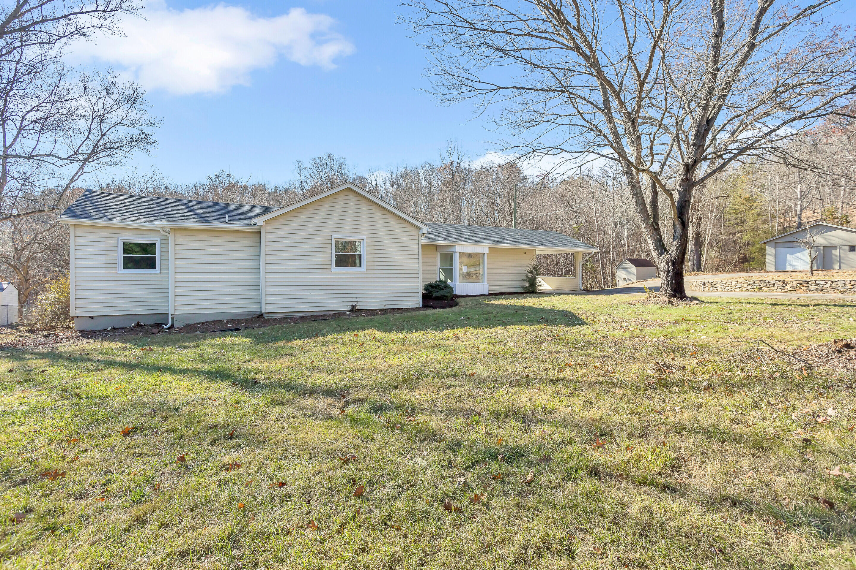 3757 Rutrough Road Southeast Roanoke, VA 24014 - Photo 2 of 42 a house view with a garden space