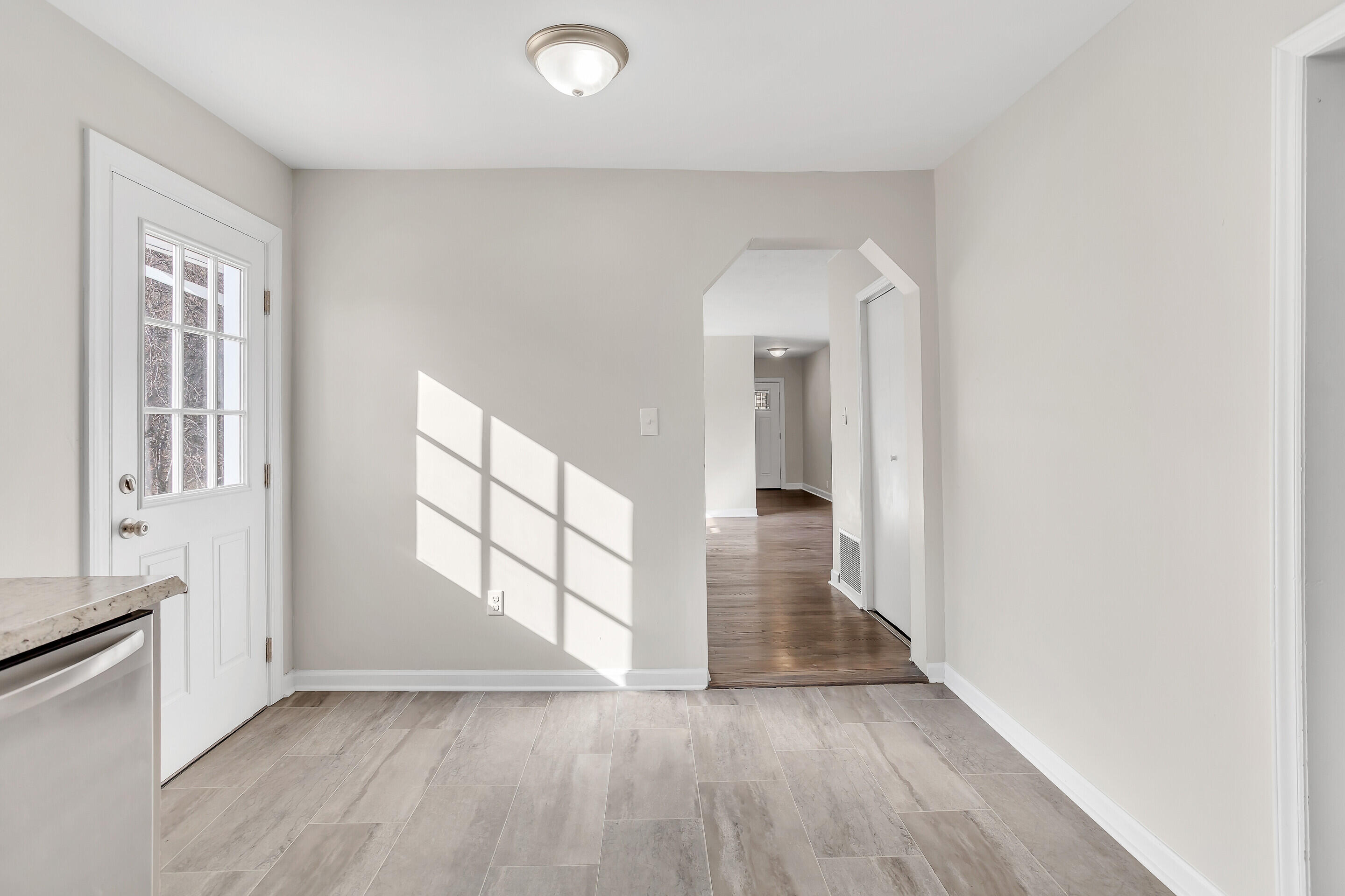 3757 Rutrough Road Southeast Roanoke, VA 24014 - Photo 13 of 42 wooden floor in an empty room with a window