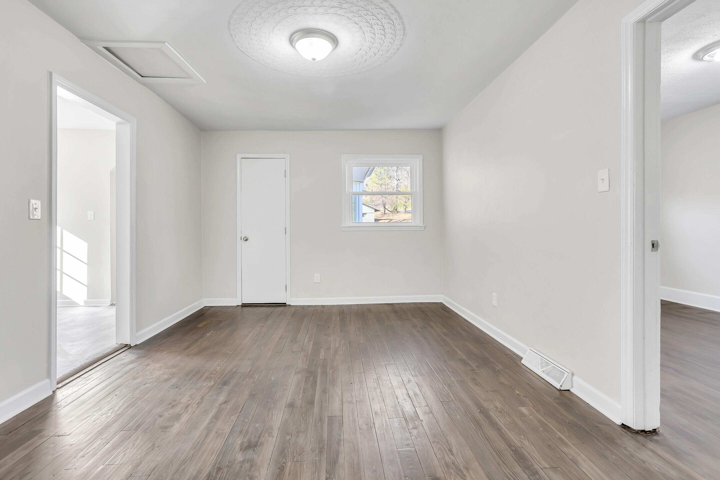 3757 Rutrough Road Southeast Roanoke, VA 24014 - Photo 16 of 42 an empty room with wooden floor and windows