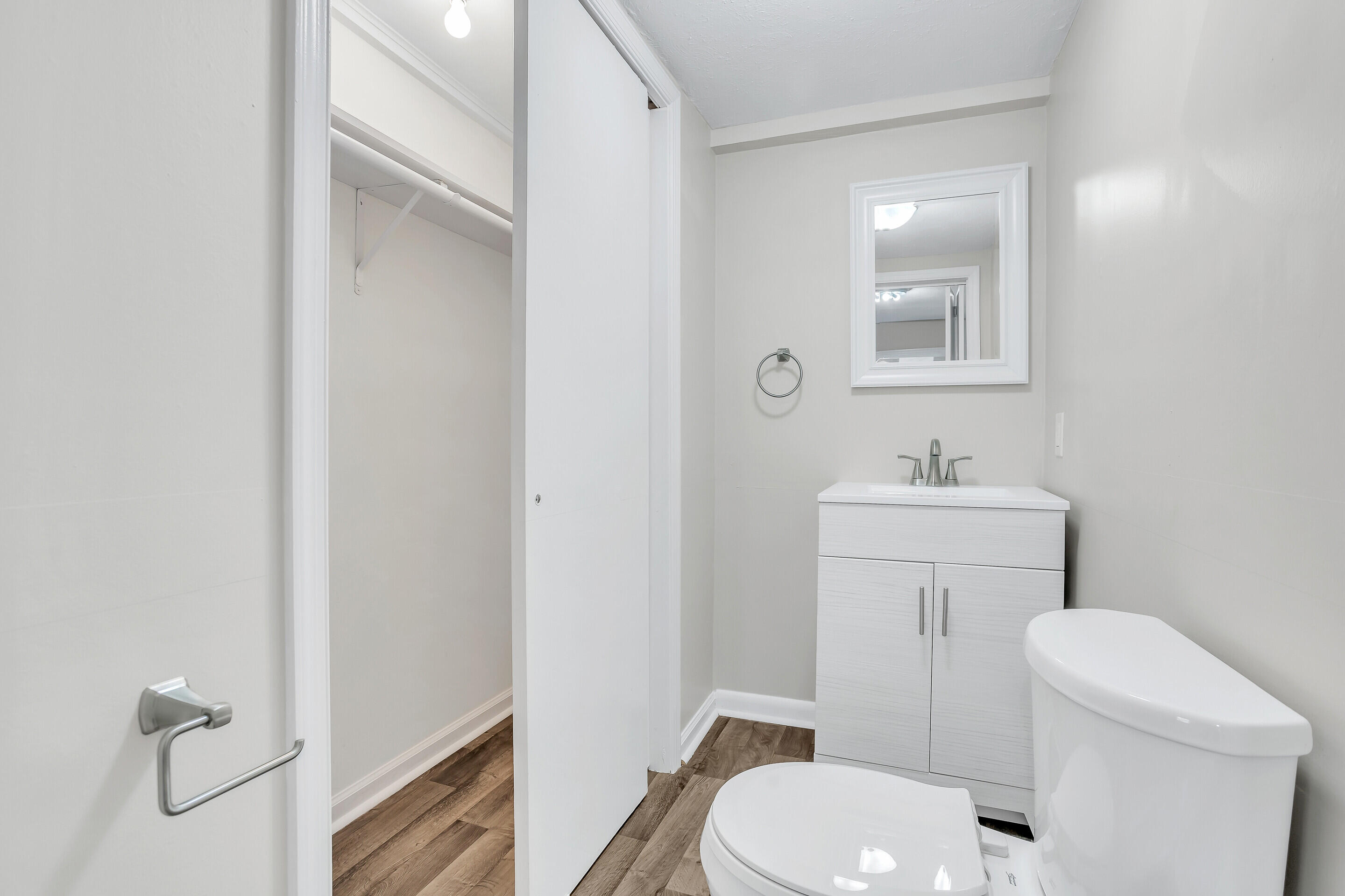 3757 Rutrough Road Southeast Roanoke, VA 24014 - Photo 19 of 42 a bathroom with a toilet a sink a mirror and vanity