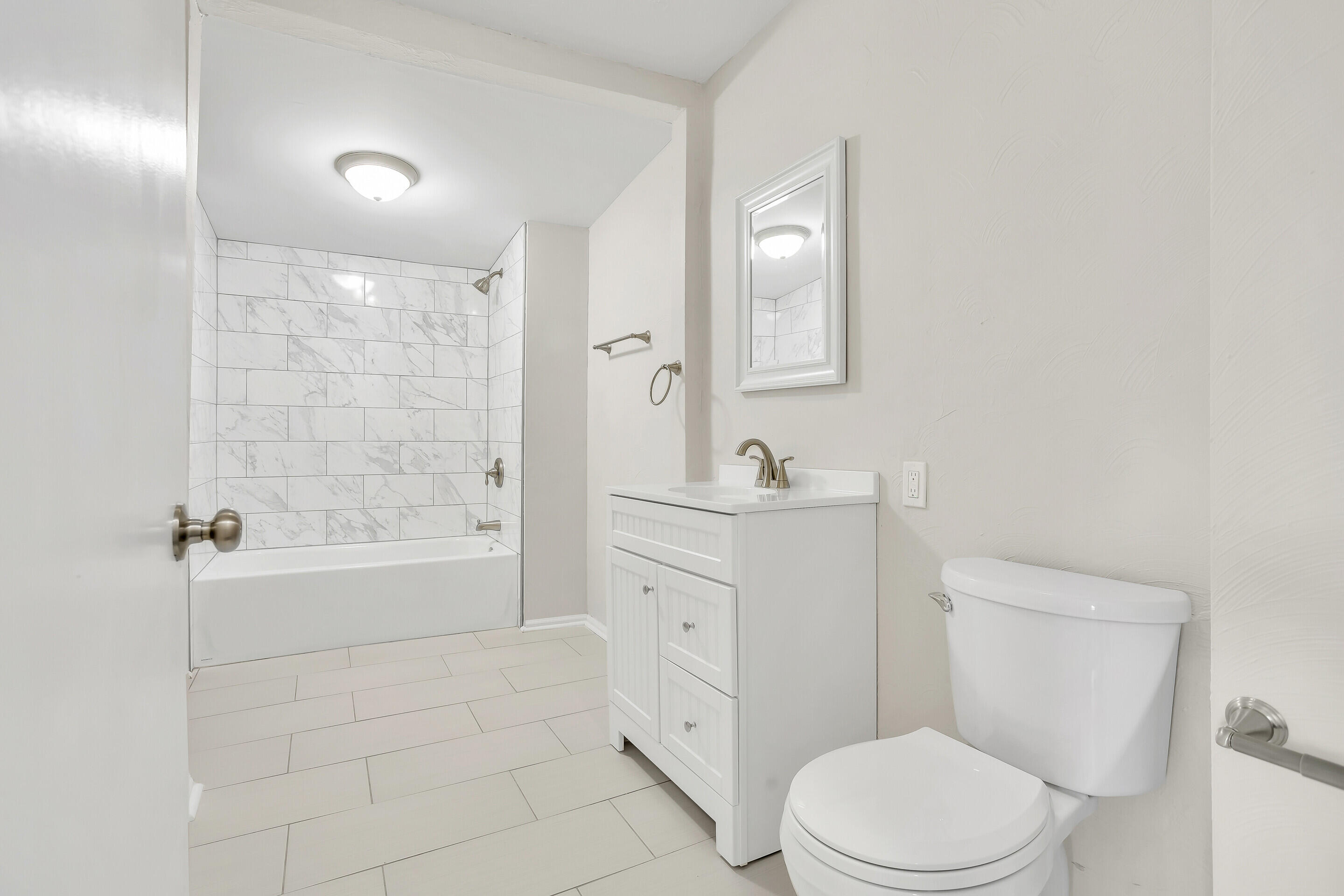3757 Rutrough Road Southeast Roanoke, VA 24014 - Photo 20 of 42 a bathroom with a granite countertop toilet a sink and bathtub