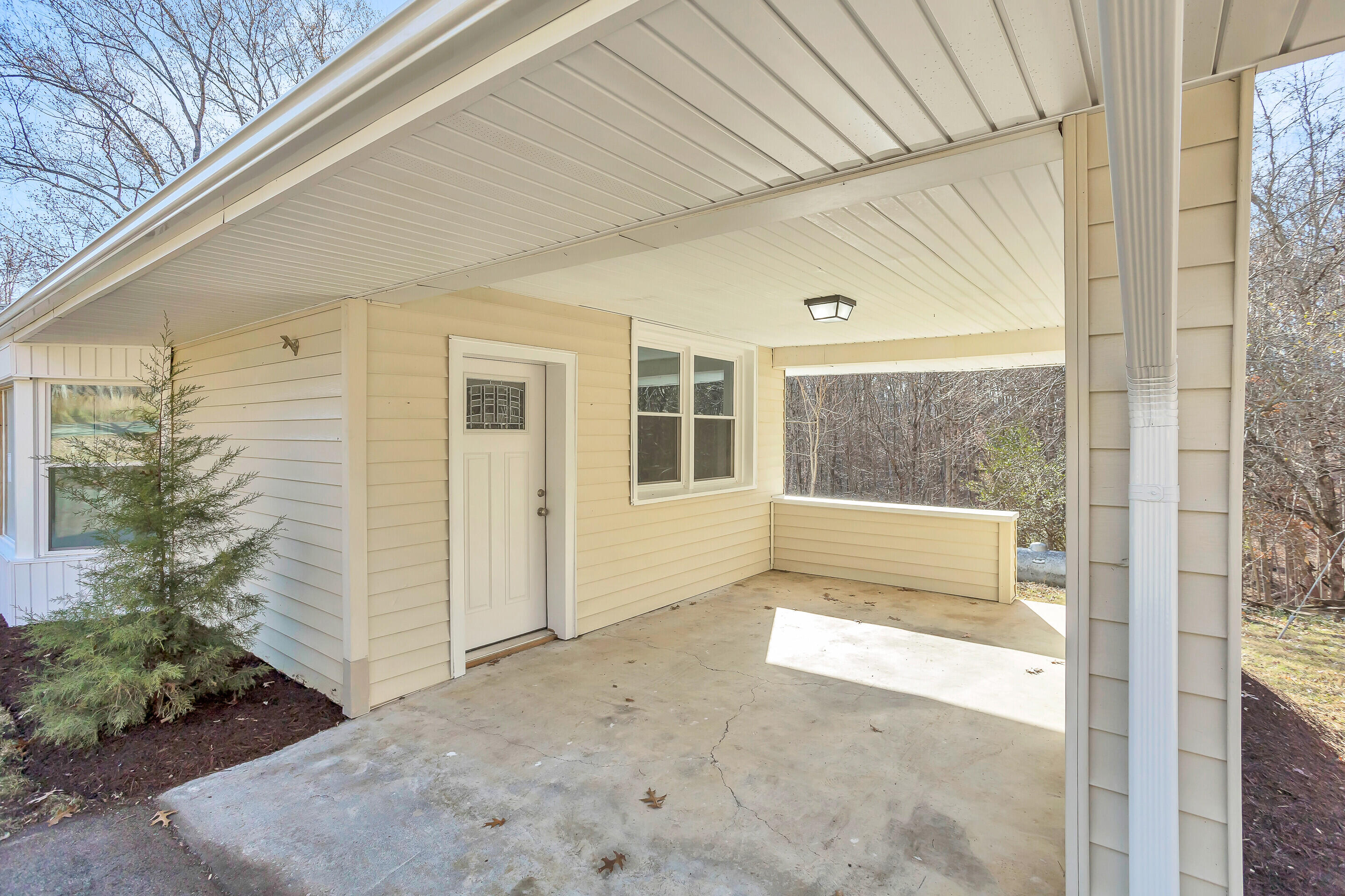 3757 Rutrough Road Southeast Roanoke, VA 24014 - Photo 3 of 42 a view of backyard with large window and wooden fence