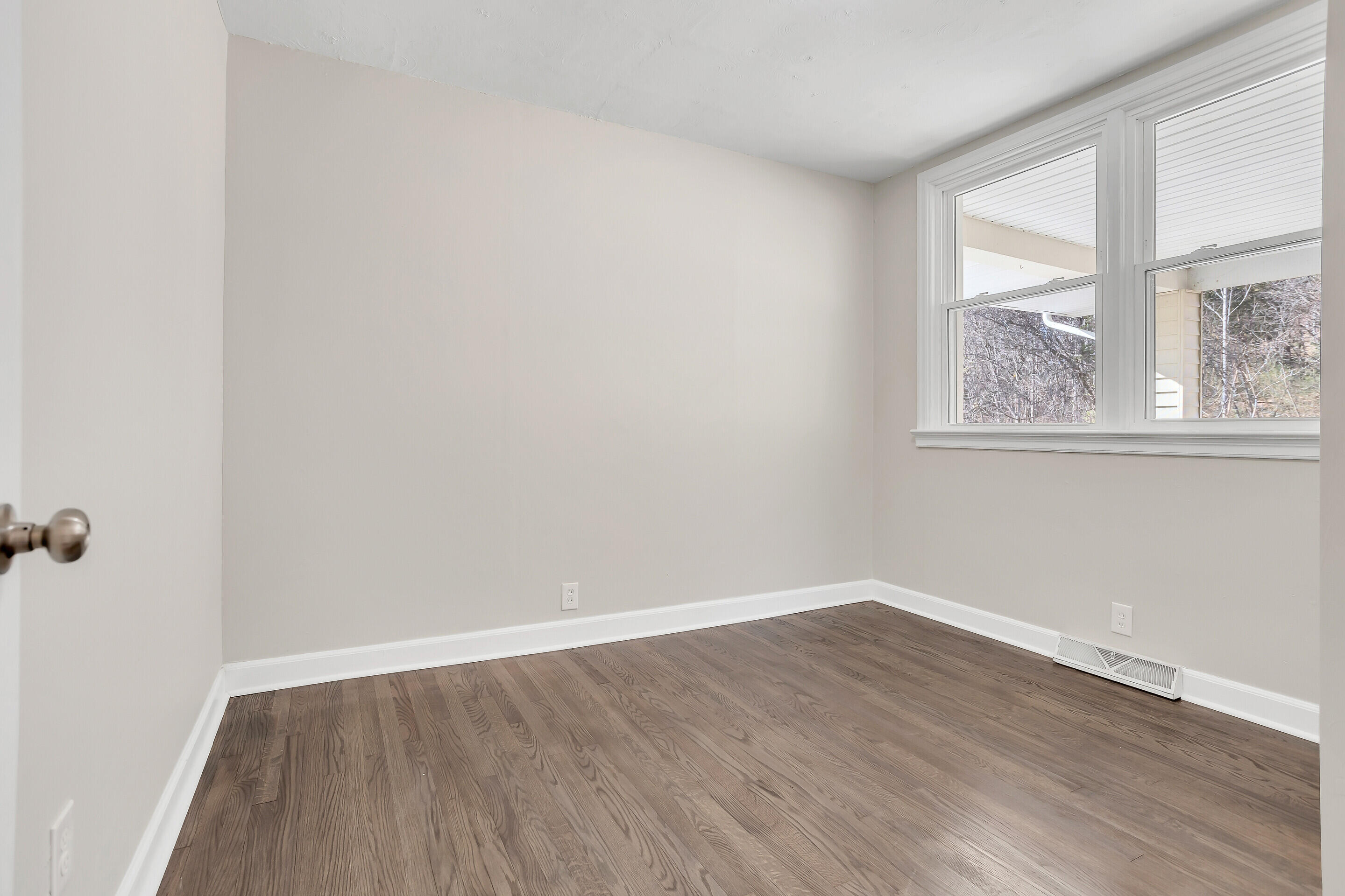 3757 Rutrough Road Southeast Roanoke, VA 24014 - Photo 5 of 42 wooden floor in an empty room with a window