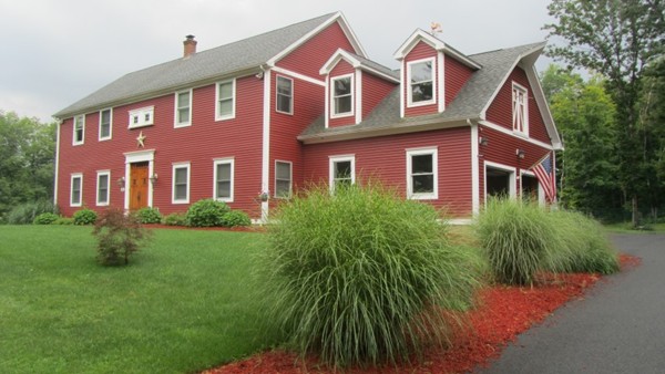 489 Market Hill Road Amherst, MA 01002 - Photo 1 of 27 a front view of a house with yard and green space