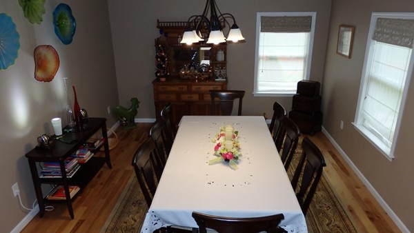 489 Market Hill Road Amherst, MA 01002 - Photo 11 of 27 a view of dining room with furniture and wooden floor