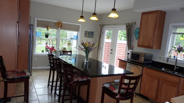 489 Market Hill Road Amherst, MA 01002 - Photo 6 of 27 a view of a dining room with furniture window and outside view