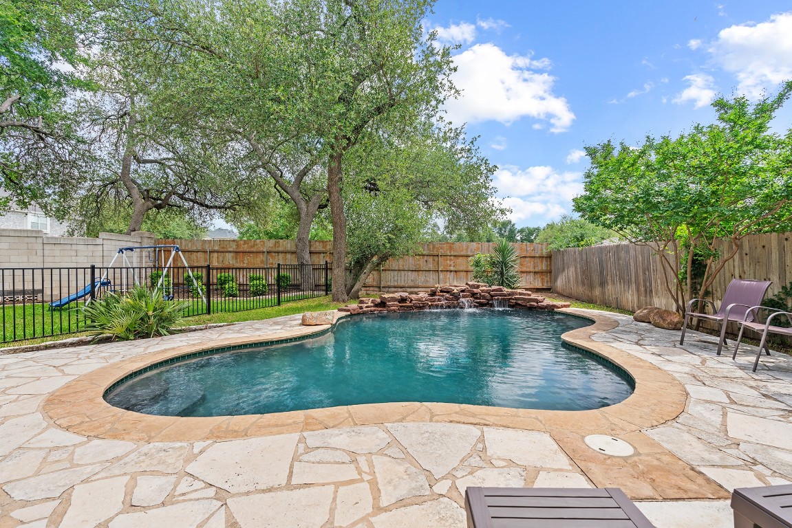 1200 Old Mill Road Cedar Park, TX 78613 - Photo 1 of 40 a view of a swimming pool with a patio