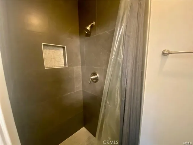 a bathroom with a double vanity sink and mirror