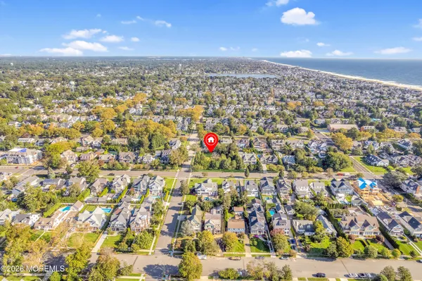 an aerial view of a houses with a city