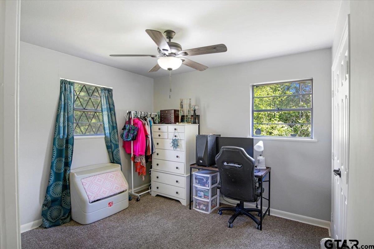 10638 County Road 384 Tyler, TX 75708 - Photo 13 of 33 a view of a workspace with furniture and a window