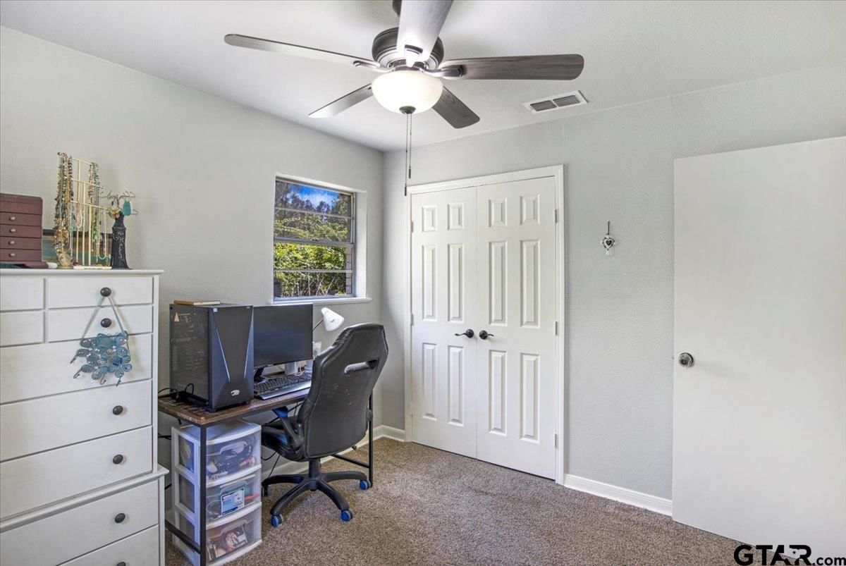 10638 County Road 384 Tyler, TX 75708 - Photo 14 of 33 a workspace with chandelier