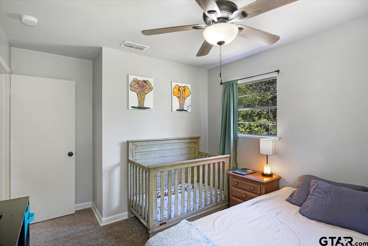10638 County Road 384 Tyler, TX 75708 - Photo 17 of 33 a bedroom with furniture and a window