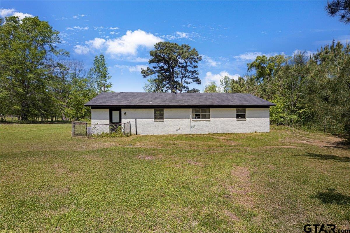 10638 County Road 384 Tyler, TX 75708 - Photo 22 of 33 a front view of house with garden space and swimming pool