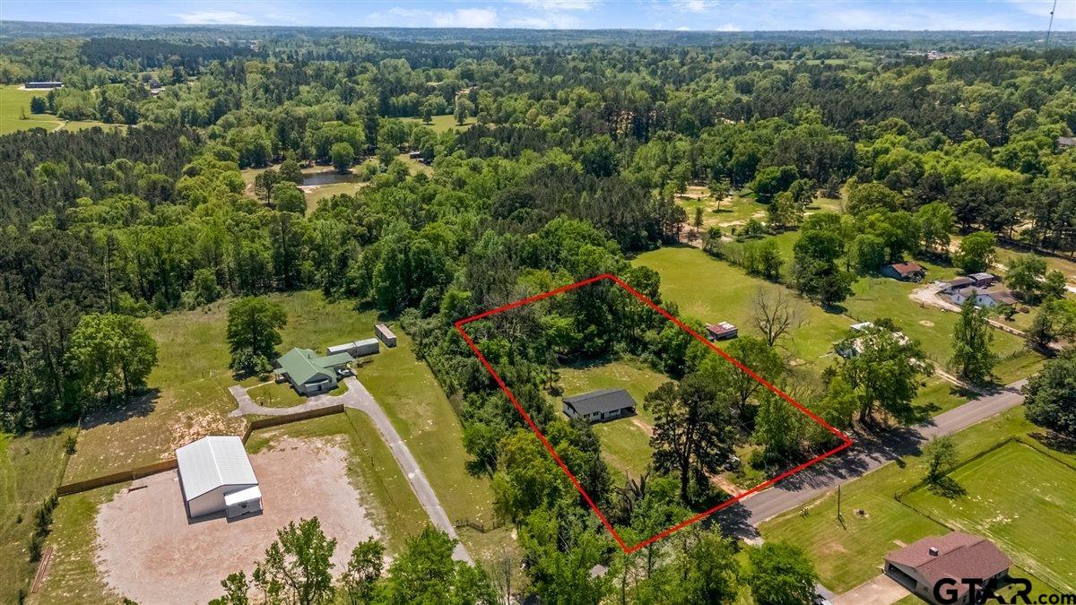 10638 County Road 384 Tyler, TX 75708 - Photo 28 of 33 an aerial view of a house with a yard