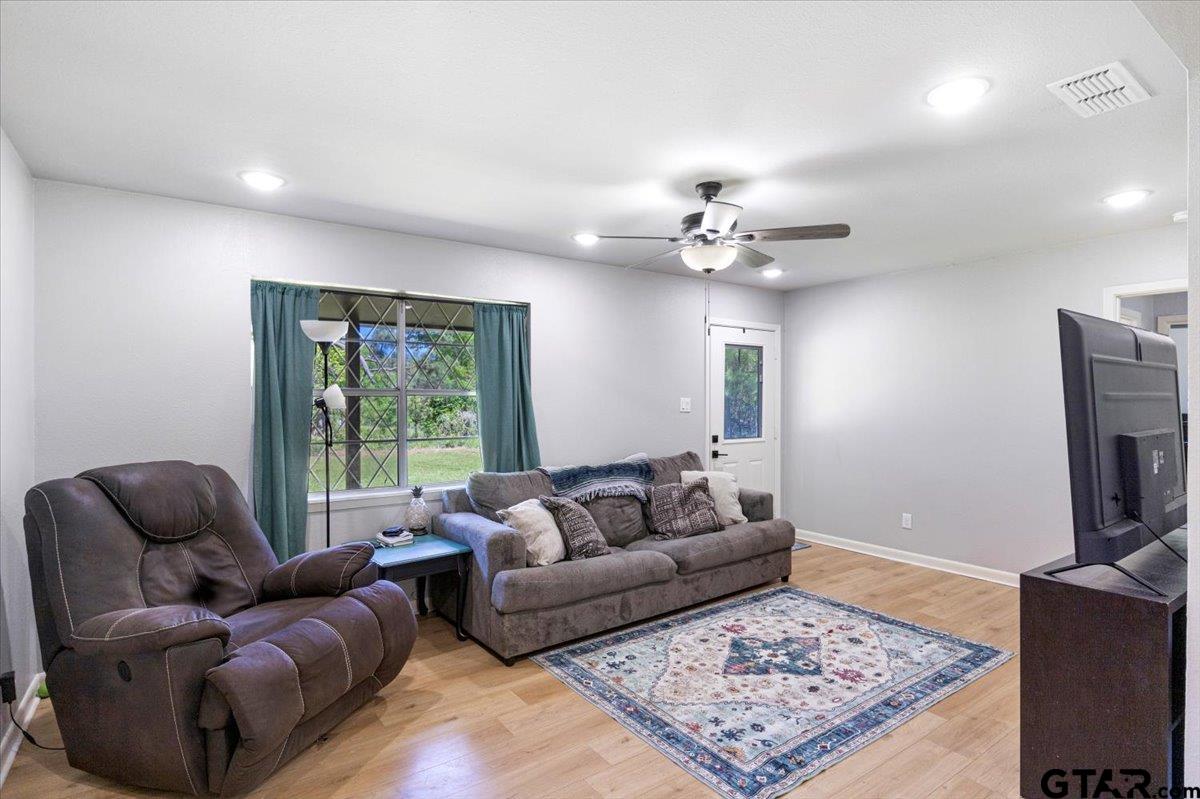 10638 County Road 384 Tyler, TX 75708 - Photo 5 of 33 a living room with furniture and a flat screen tv