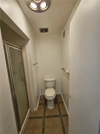 a bathroom with a toilet