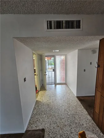a view of livingroom with hardwood floor and hallway