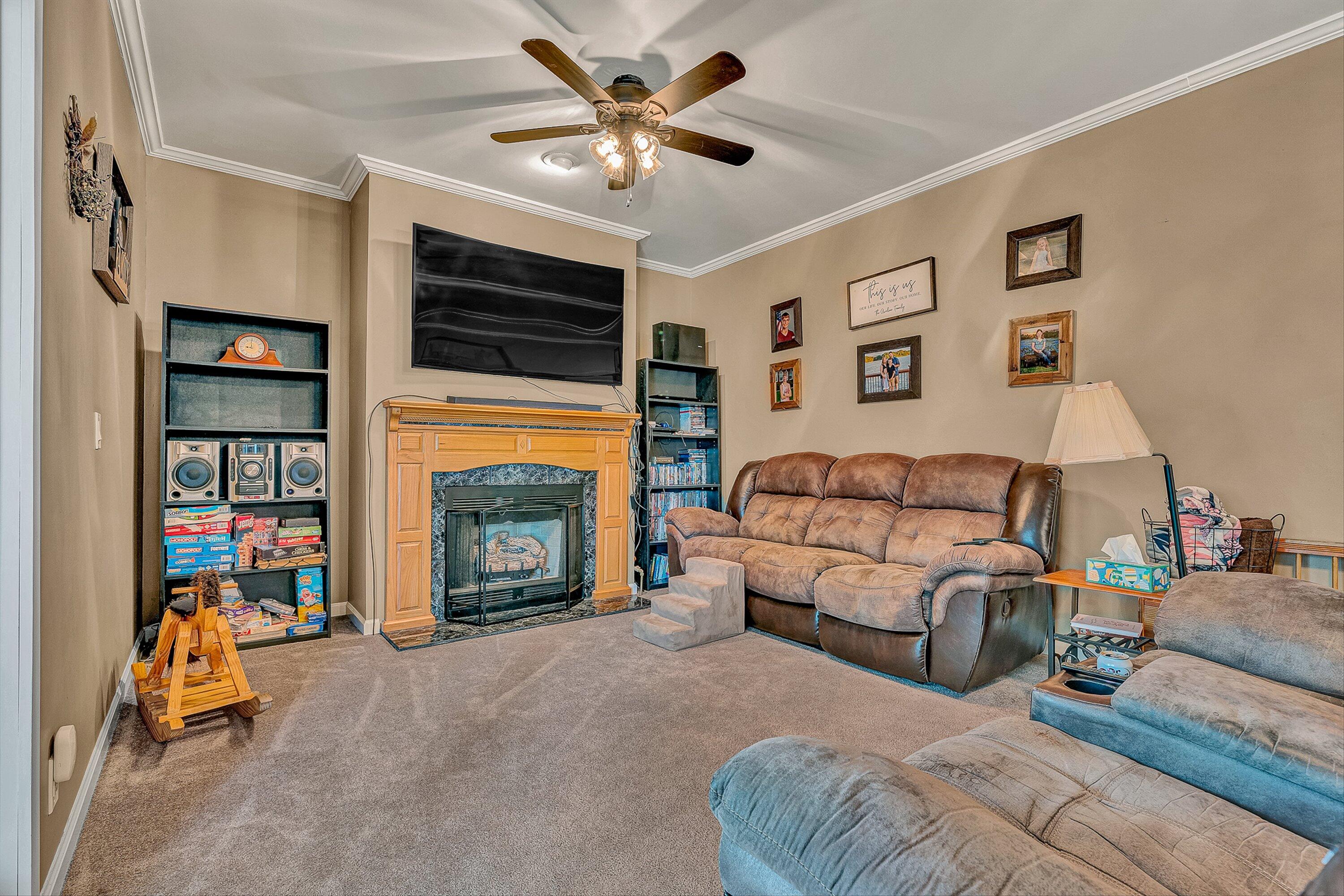 159 Simmons Creek Road Union Hall, VA 24176 - Photo 16 of 55 a living room with furniture a fireplace and a flat screen tv