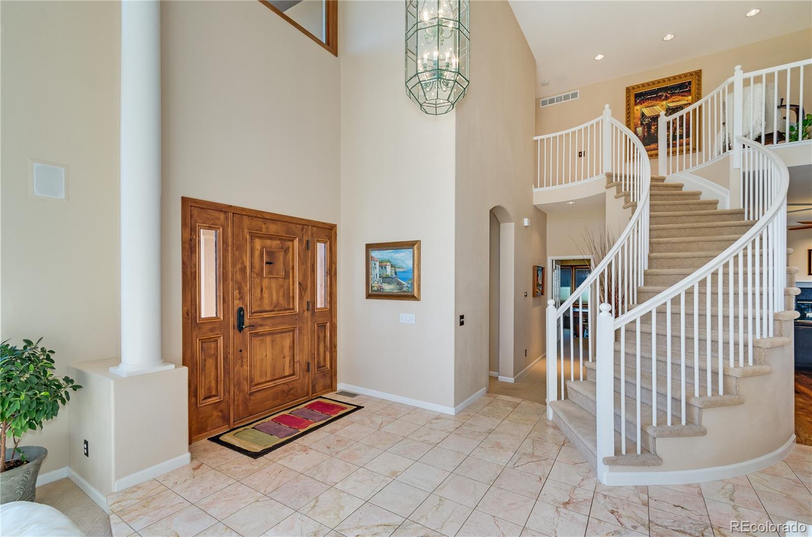83 North Ranch Road Littleton, CO 80127 - Photo 3 of 35 a view of entryway with livingroom and stairs