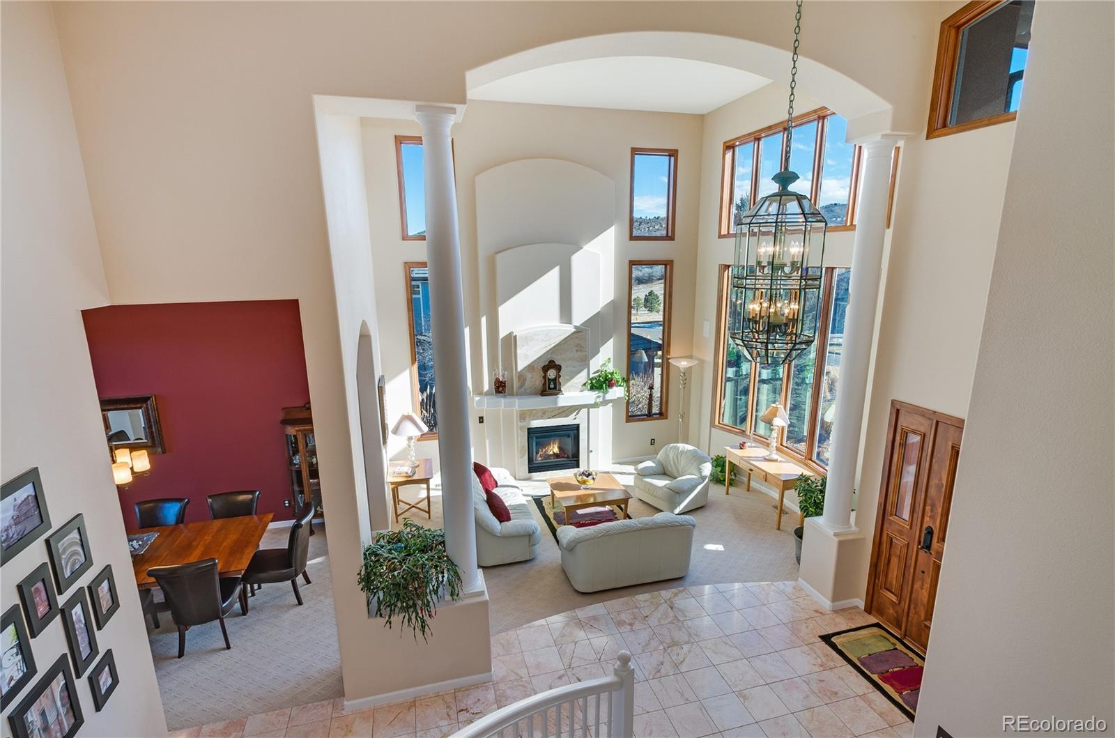 83 North Ranch Road Littleton, CO 80127 - Photo 4 of 35 a living room with furniture a fireplace and a potted plant