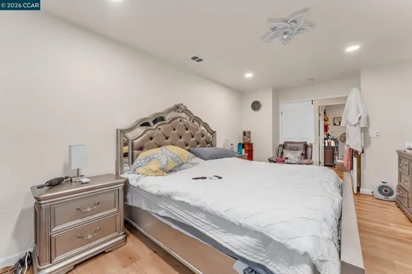 a large bed sitting in a bedroom and room