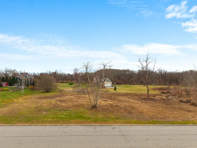 a view of lake with green space
