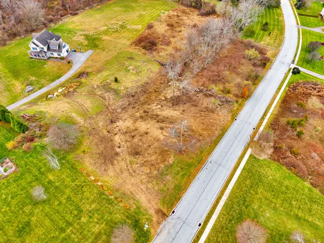 a view of a field with an ocean
