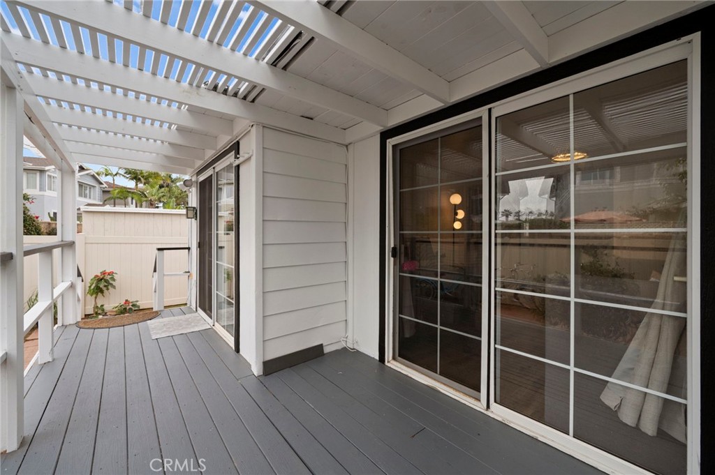 6550 Ponto Drive, Unit 17 Carlsbad, CA 92011 - Photo 29 of 48 a view of outdoor space with wooden floor and windows