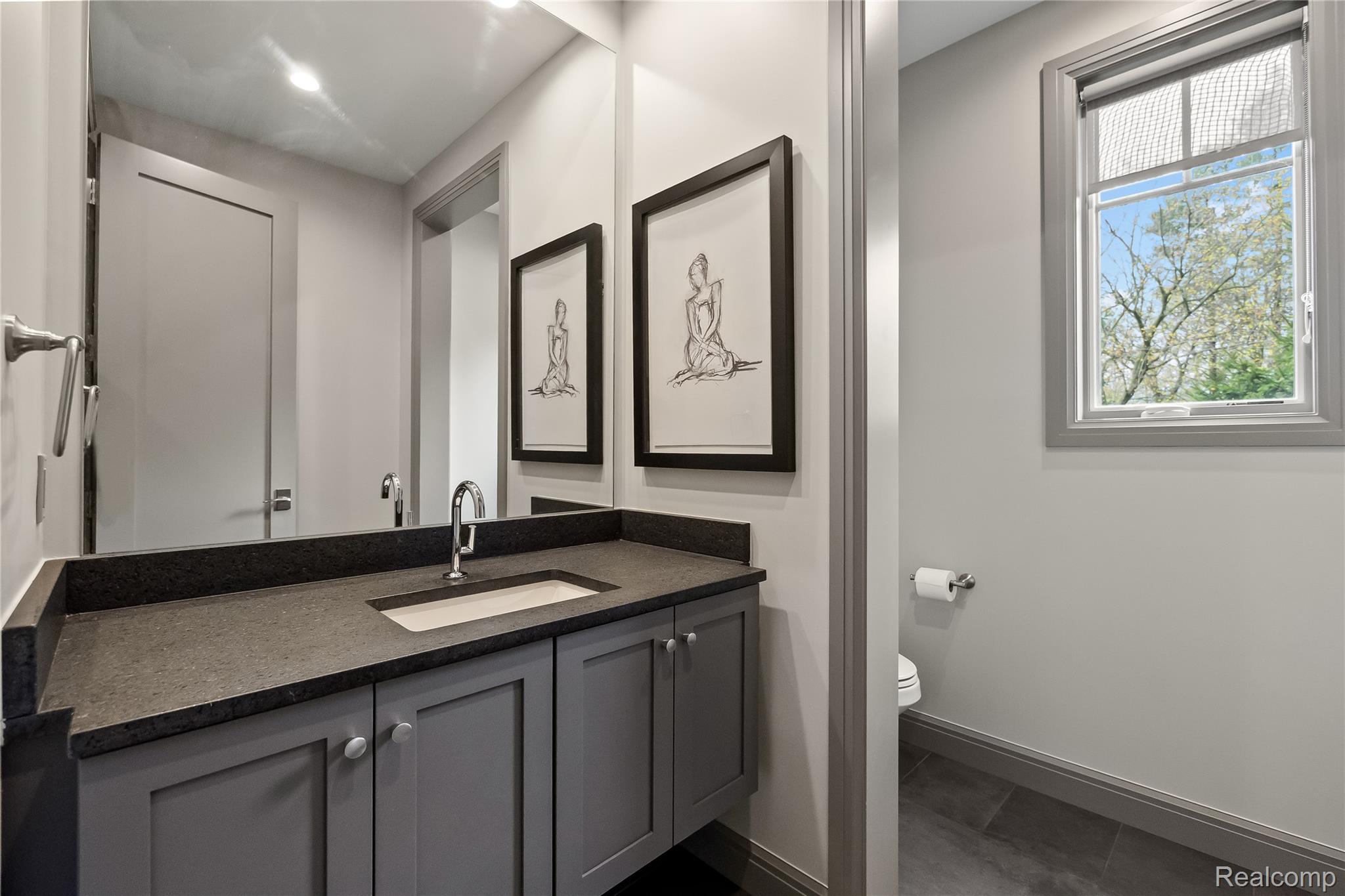 3824 Poppleton Street Troy, MI 48084 - Photo 20 of 51 Half bath featuring vanity and dark tile patterned flooring