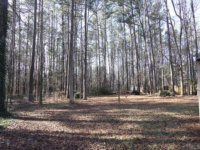 5516 Swiftbrook Circle Raleigh, NC 27606 - Photo 8 of 10 Hard to find acre wooded lot in this part of town....great for privacy and a large family....or those with pets!