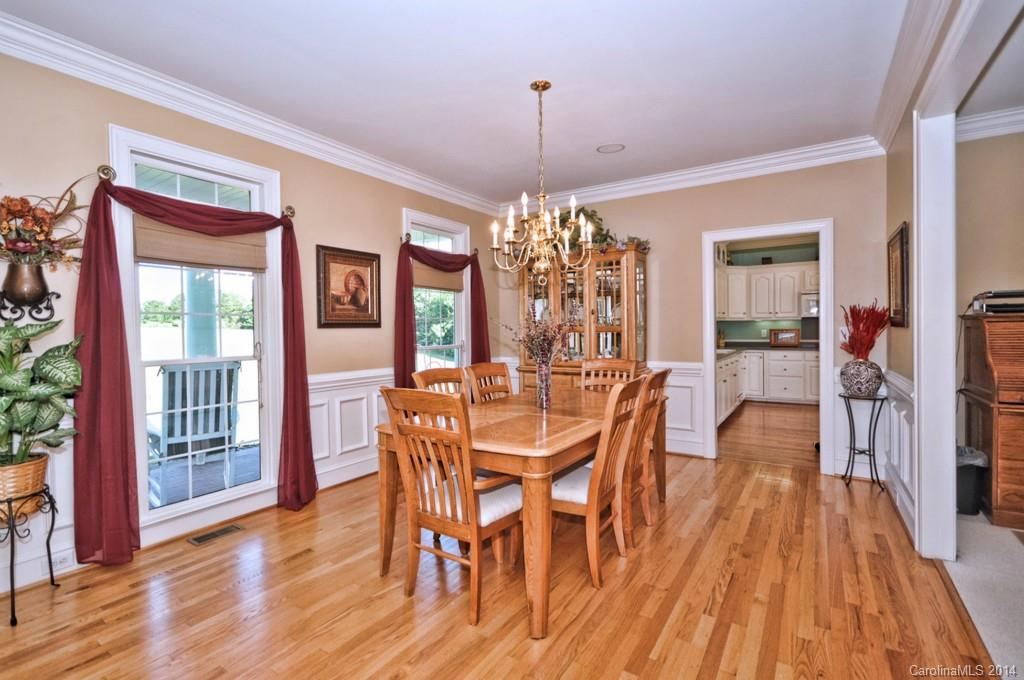 5406 Morgan Mill Road, Unit 2 Monroe, NC 28110 - Photo 4 of 23 a view of a dining room with furniture window and wooden floor
