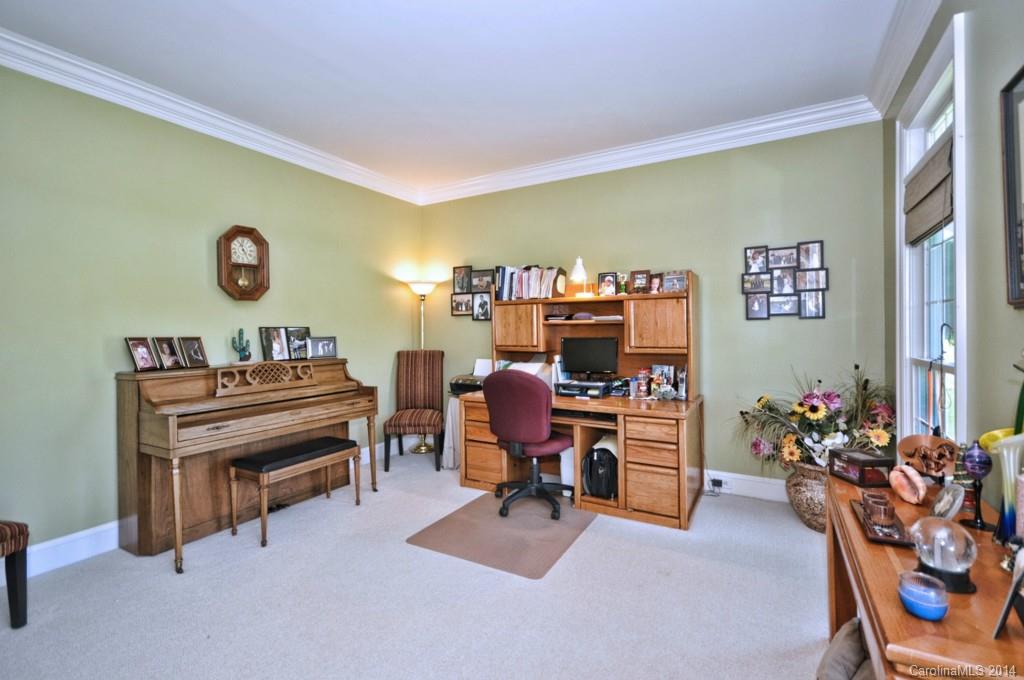 5406 Morgan Mill Road, Unit 2 Monroe, NC 28110 - Photo 6 of 23 a view of a workspace with furniture and toys