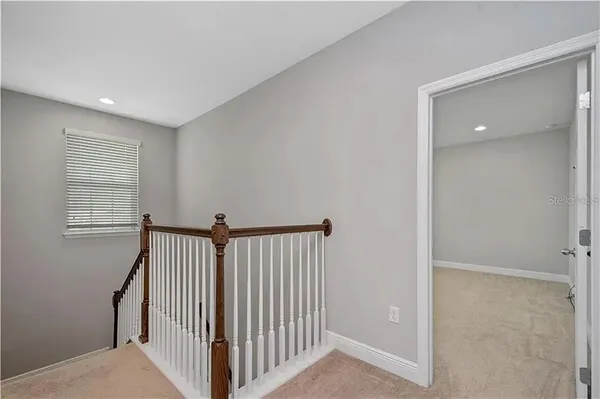 a view of a hallway with windows