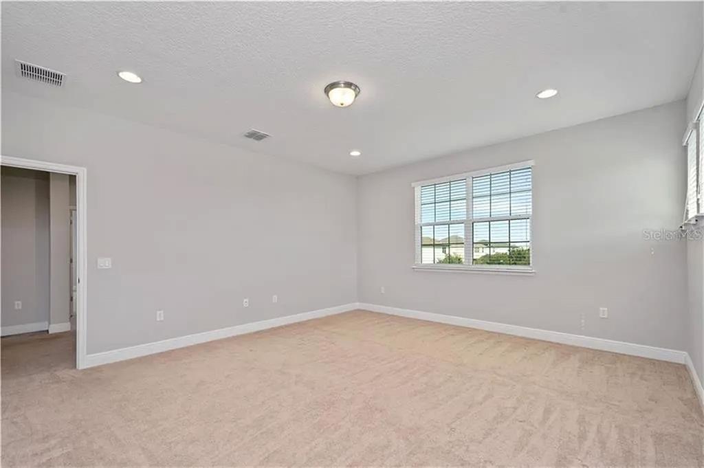 8752 Powder Ridge Trail Windermere, FL 34786 - Photo 18 of 31 an empty room with windows