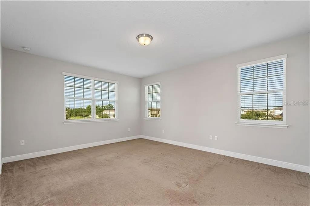 8752 Powder Ridge Trail Windermere, FL 34786 - Photo 20 of 31 an empty room with windows