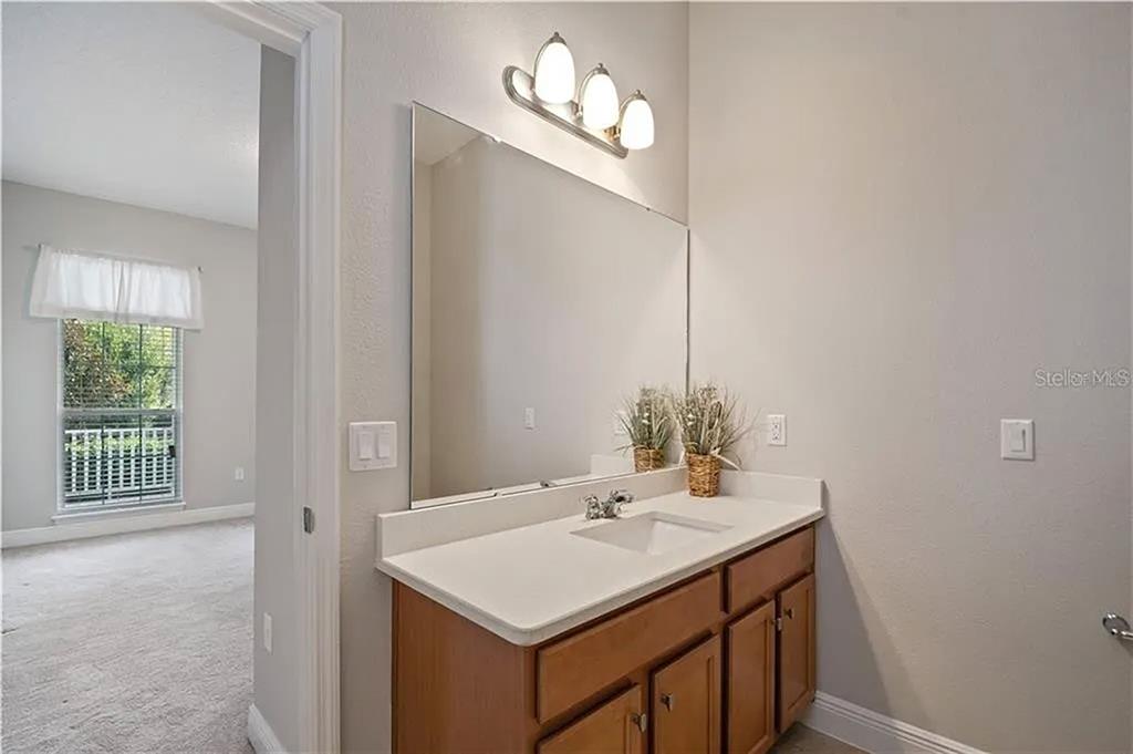 8752 Powder Ridge Trail Windermere, FL 34786 - Photo 8 of 31 a bathroom with a sink and a mirror