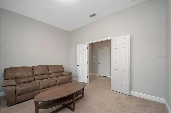 a living room with furniture a couch and dryer