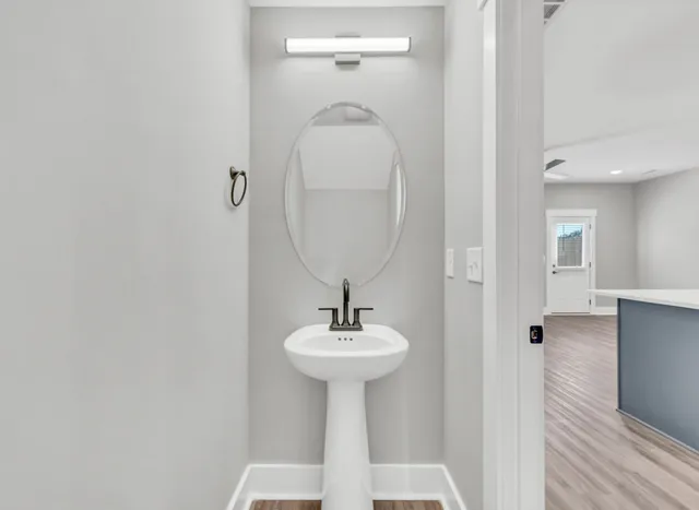 a bathroom with a sink and a mirror