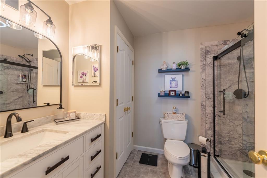 219 Adams Pointe Boulevard, Unit 9 Mars, PA 16046 - Photo 14 of 26 Primary bath has linen closet and extra storage space