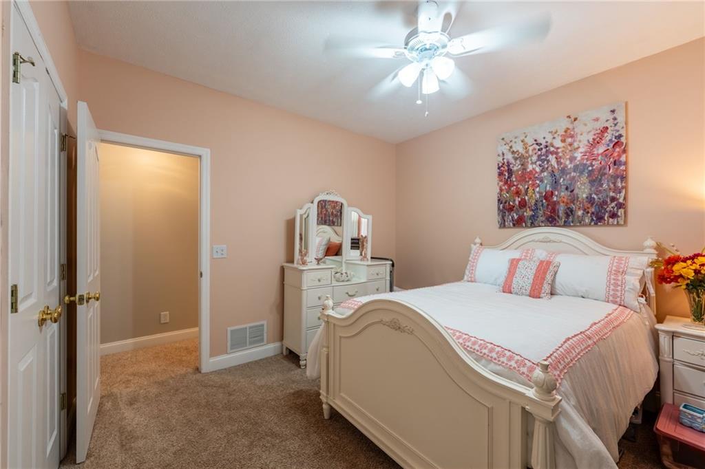 219 Adams Pointe Boulevard, Unit 9 Mars, PA 16046 - Photo 16 of 26 2nd bedroom has two closets, lighted ceiling fan.